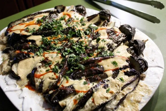 Roasted eggplant with tahini and herbs