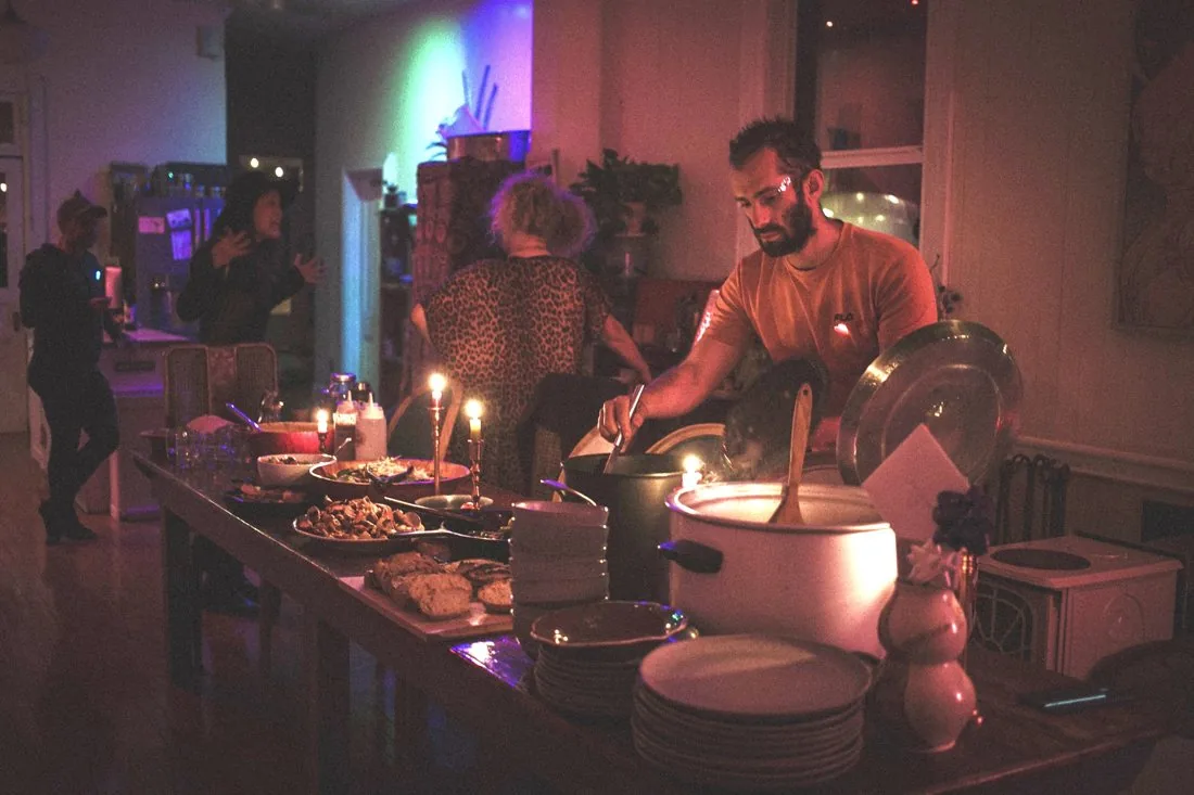 Serving guests by candlelight in the evening